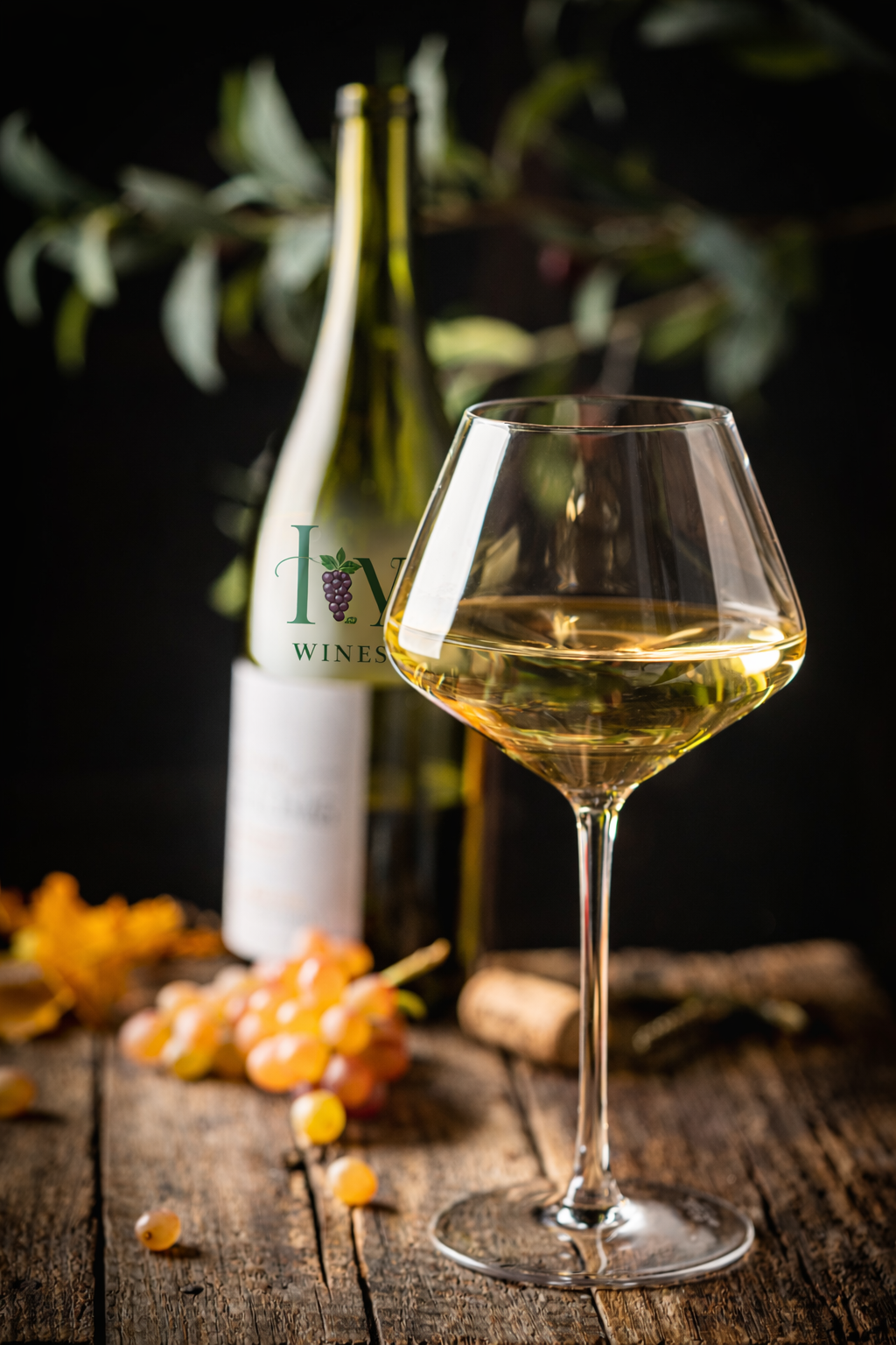 ivywines-wine-bottle-image-next-to-the grapes-on-the-table